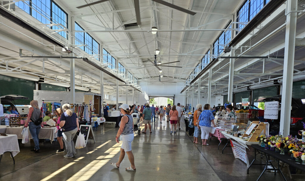 The bustling Kingsport Farmers Market features indoor and outdoor vendor booths.
