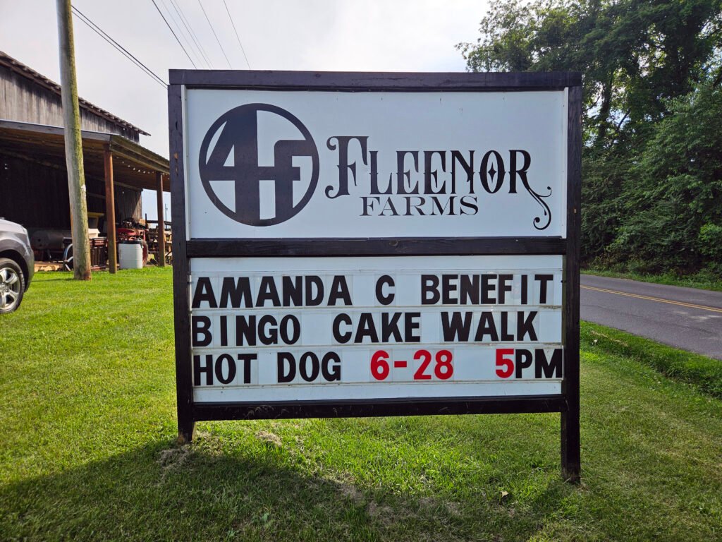 Fleenor Sign - Appalachian Highlands Farmers Magazine Sign at Fleenor Farm announcing the Fund Raiser for Amanda Collins.