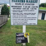 The sign at the Lebanon, VA Farmers Market lists the hours and days off the Market