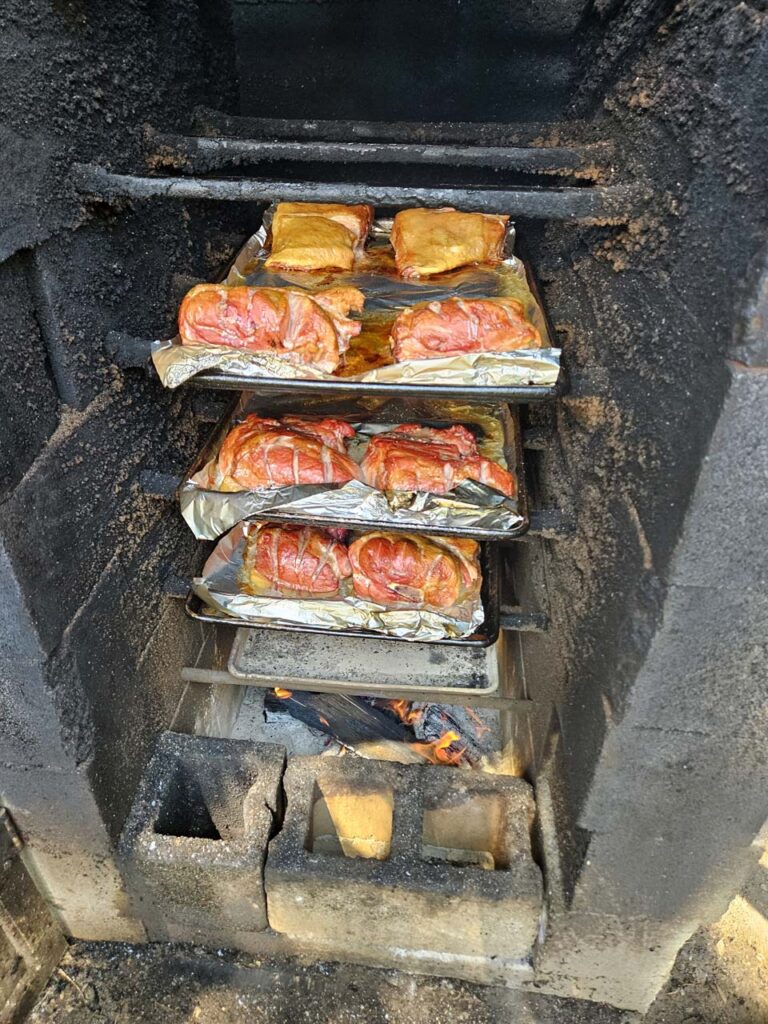 The firebox below the meat is the direct heat that cooks the meat.