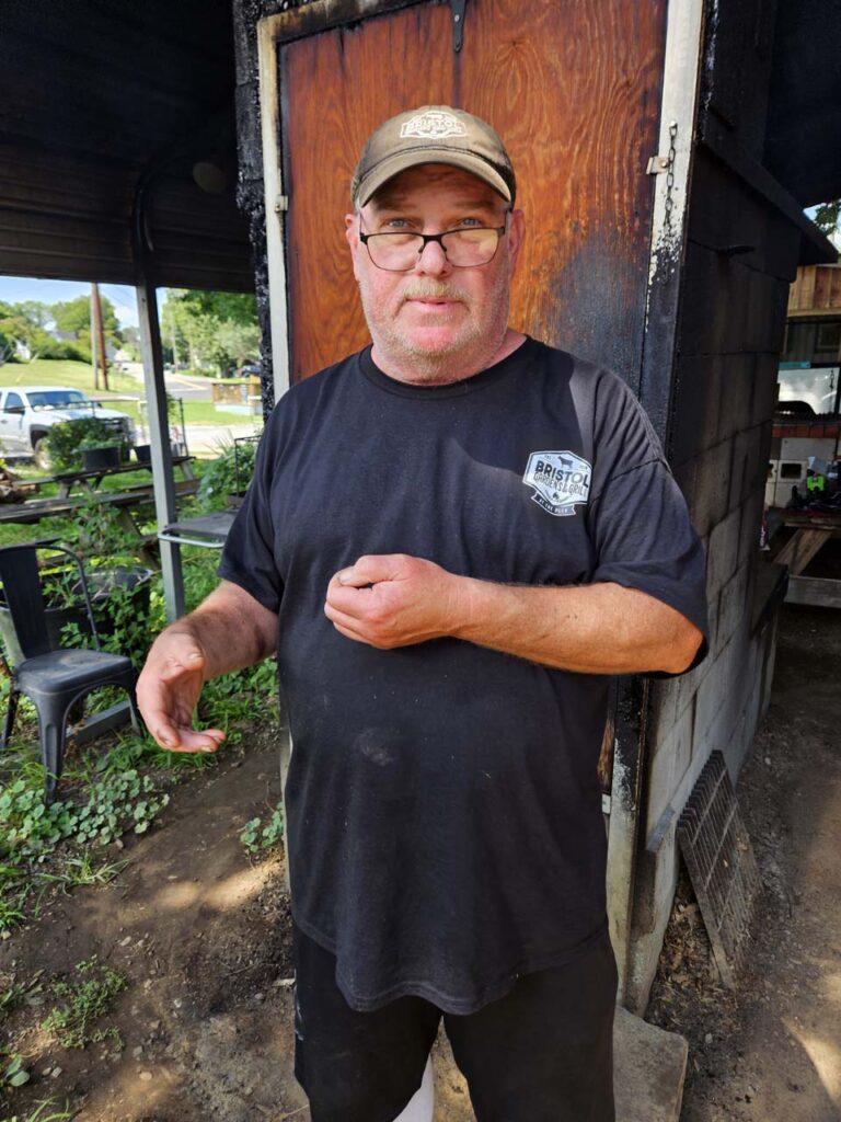 Matt proudly stands in from of his smokey creation