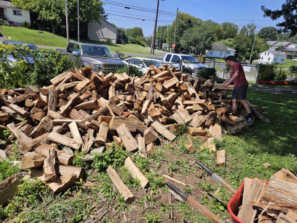 Keegan Anderson working the wood pile