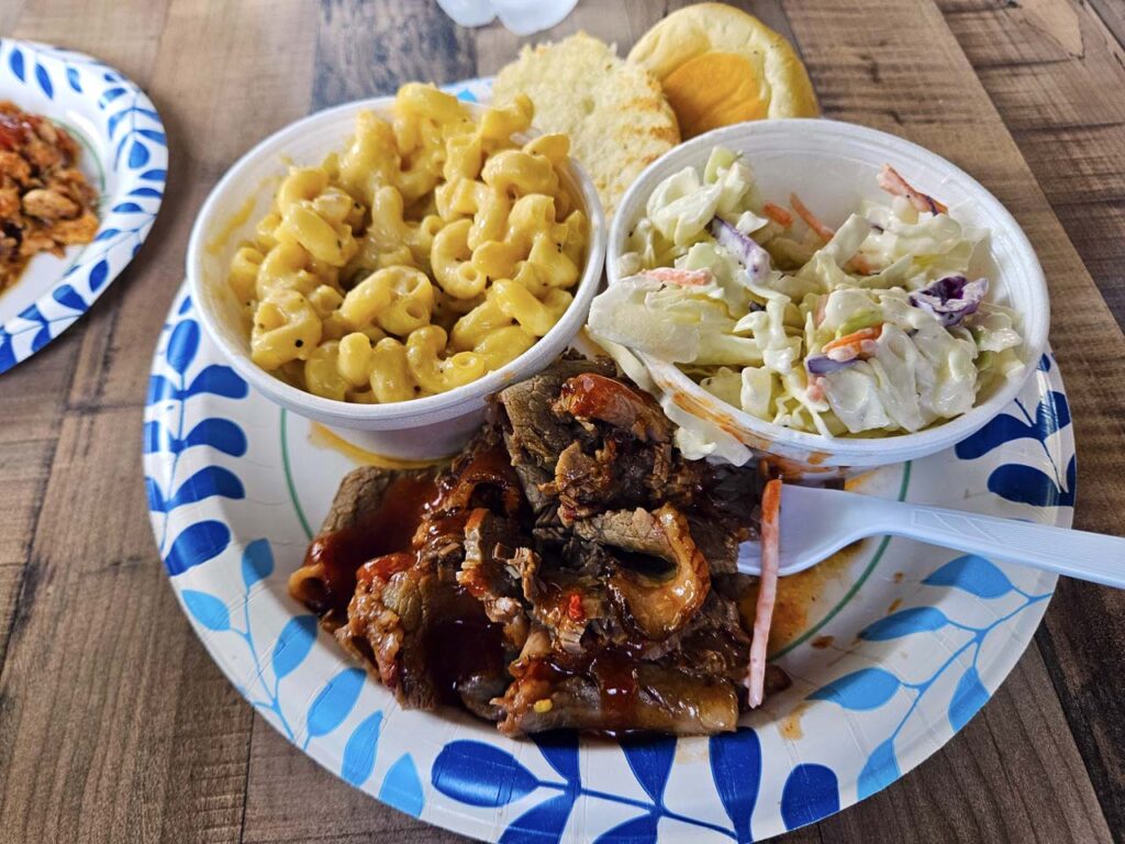 Brisket with sides of Mac & Cheese and Cole Slaw