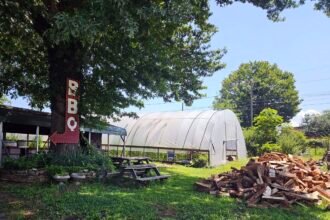 The pit, Greenhouse, and wood supply for Bristol Gardens and Grill