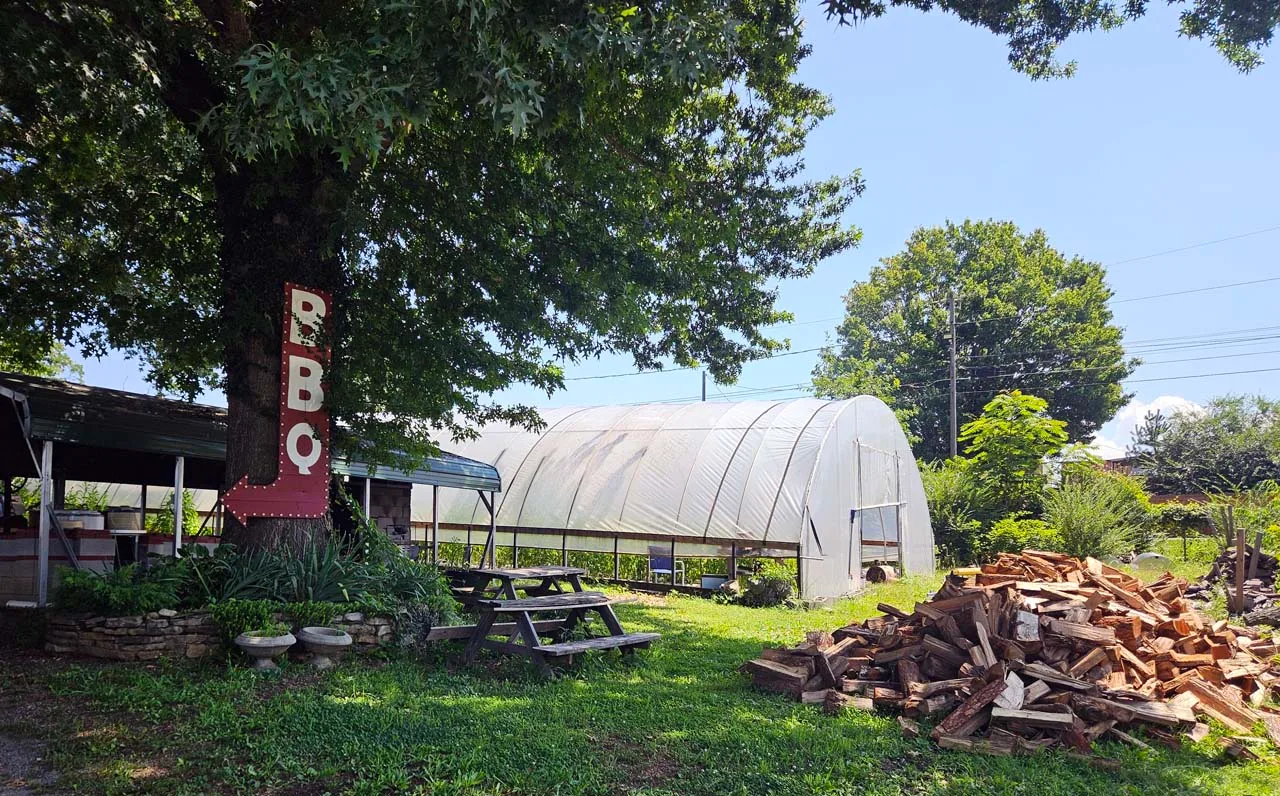 The pit, Greenhouse, and wood supply for Bristol Gardens and Grill