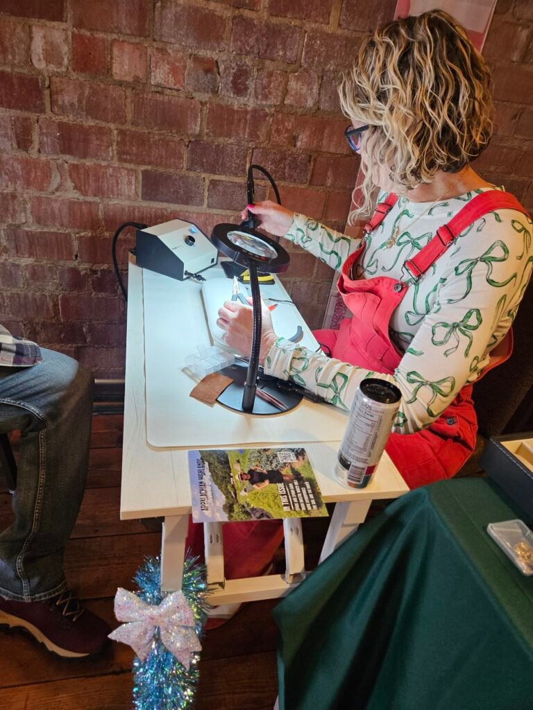 Sydney Peltier welding a custom bracelet.