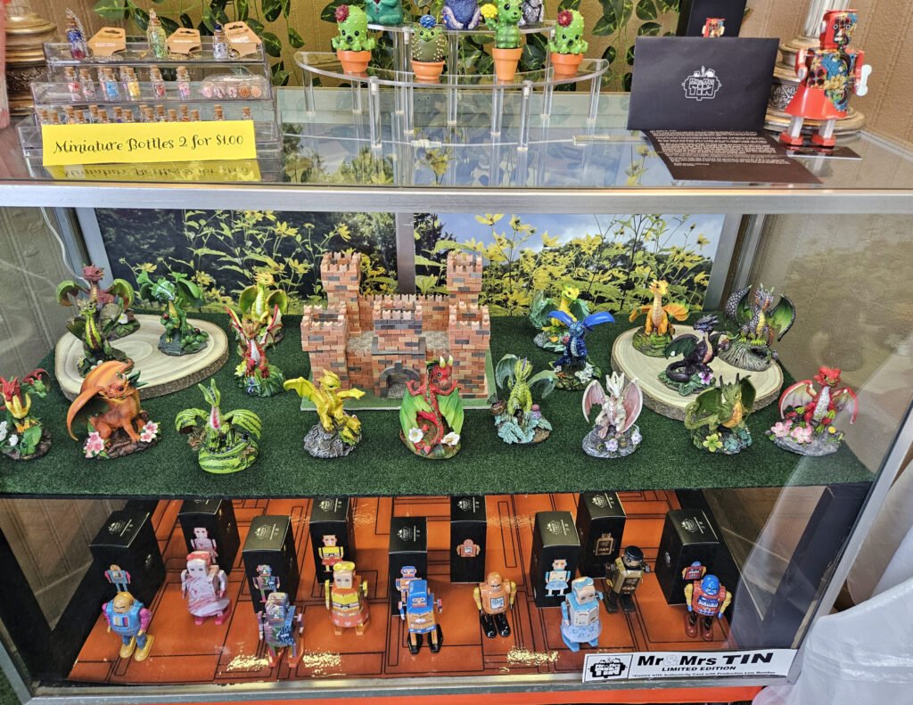 Miniature Bottles, figurines, and Mr. and Mrs. Tin Wind up Robots