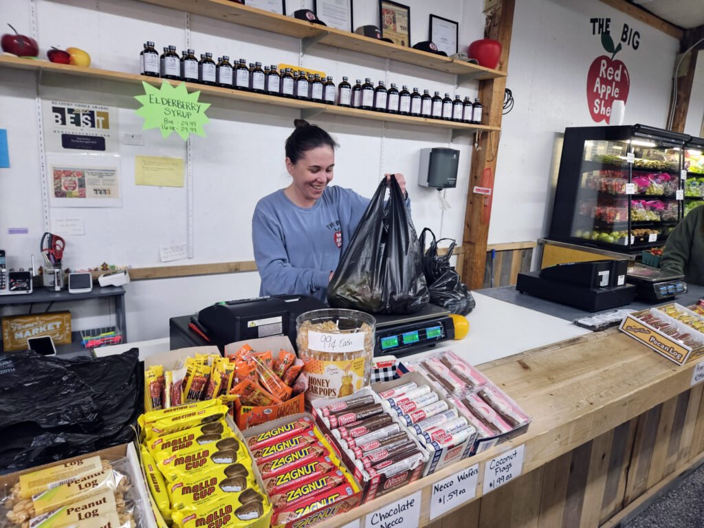 Helpful Store Clerk ringing up orders