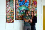 Mohsin and Katlin in front of custom art