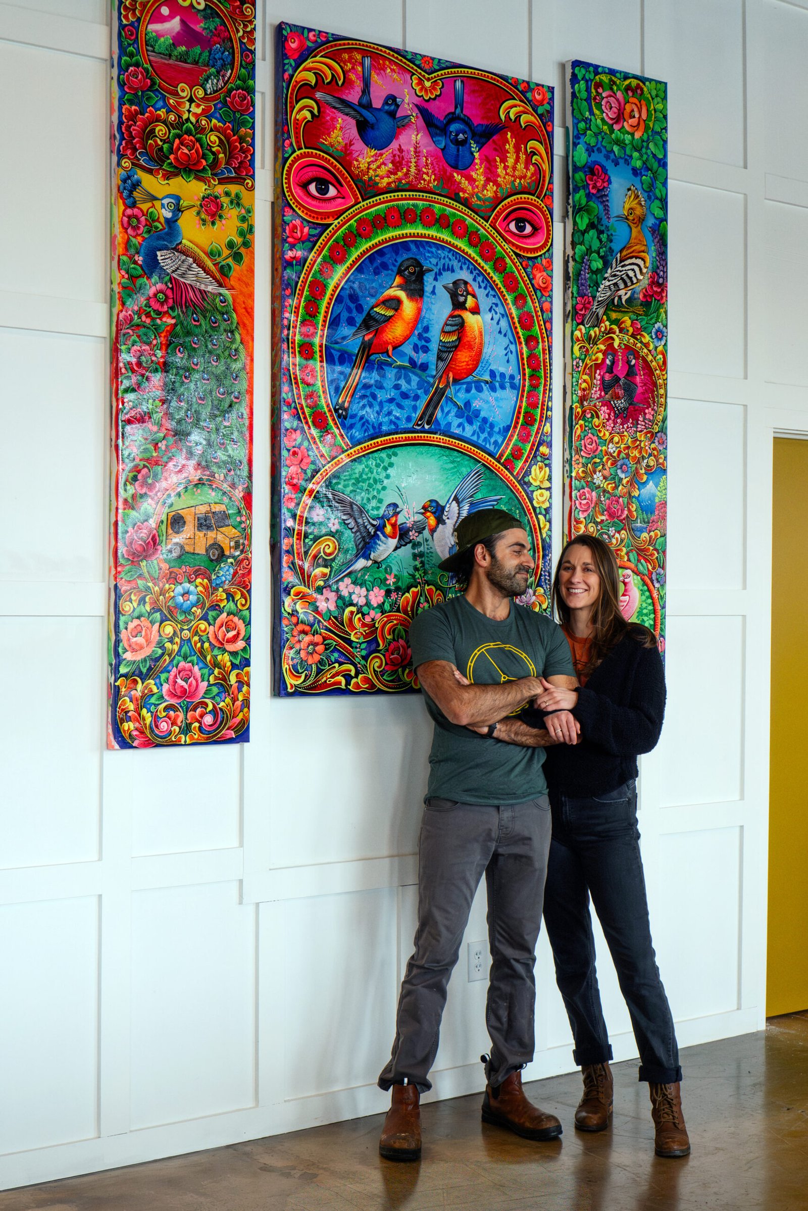 Copy of WHEELER_Pakalachian_Jan2026_Portraits-23 - Appalachian Highlands Farmers Magazine Mohsin and Katlin in front of custom art
