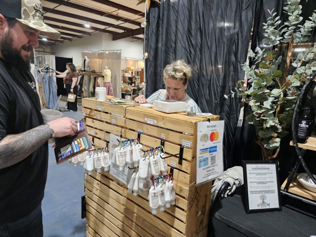 Lesley helps a customer at the Vintage Market