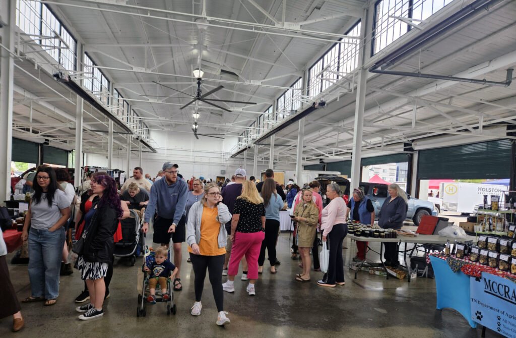 20260425_103509 - Appalachian Highlands Farmers Magazine A crowd of shoppers browsing stalls inside the a Kingsport Farmers Market