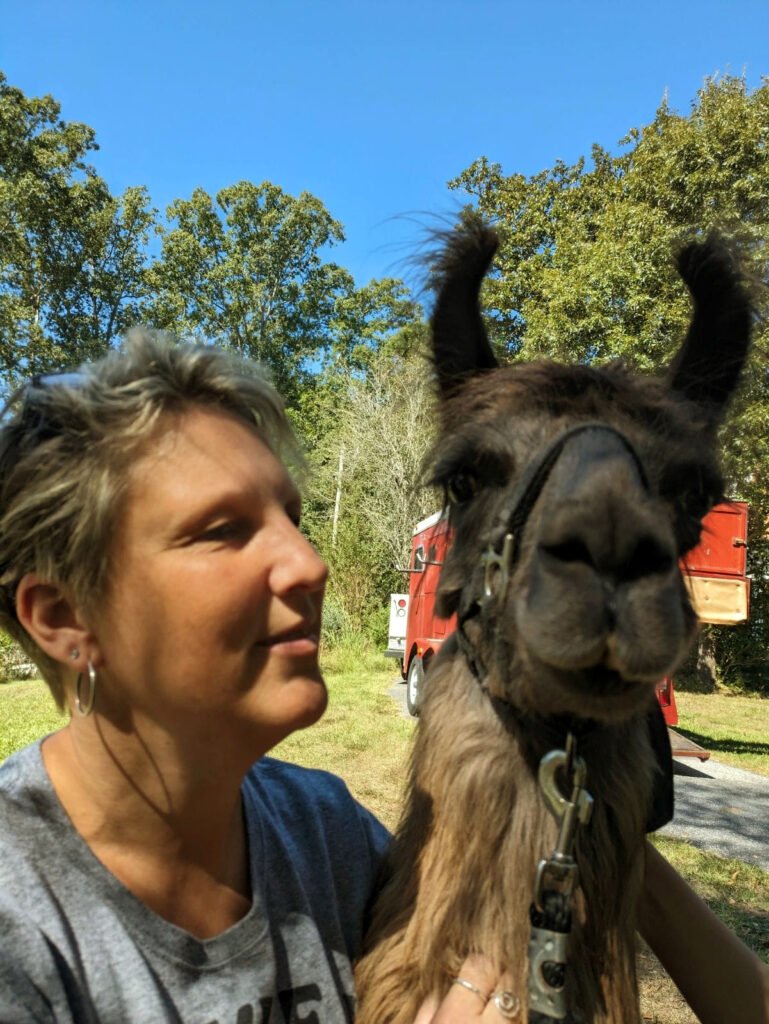 Lesley petting a Llama