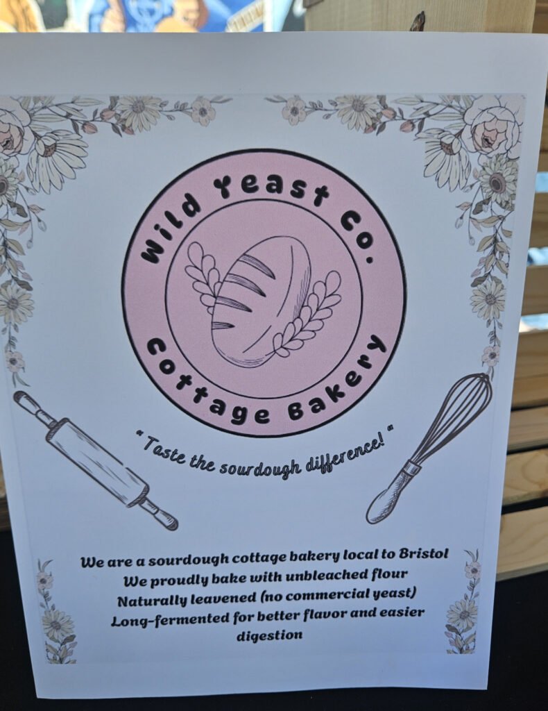 Poster for Wild Yeast Co. sourdough cottage bakery with a pink circular logo and floral border, plus rolling pin and whisk illustrations.