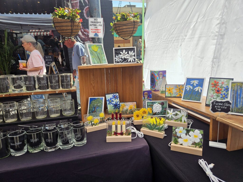 Etched glasses made from old bottles and artwork made with glass from Old World Glass Studio