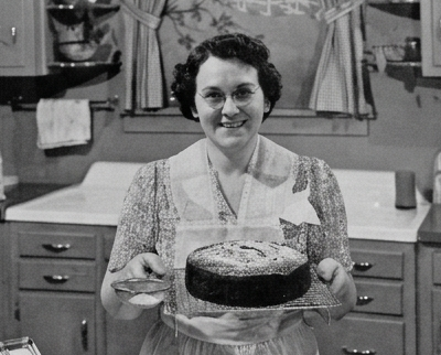 Vintage image of a grandma type with a chocolate cake