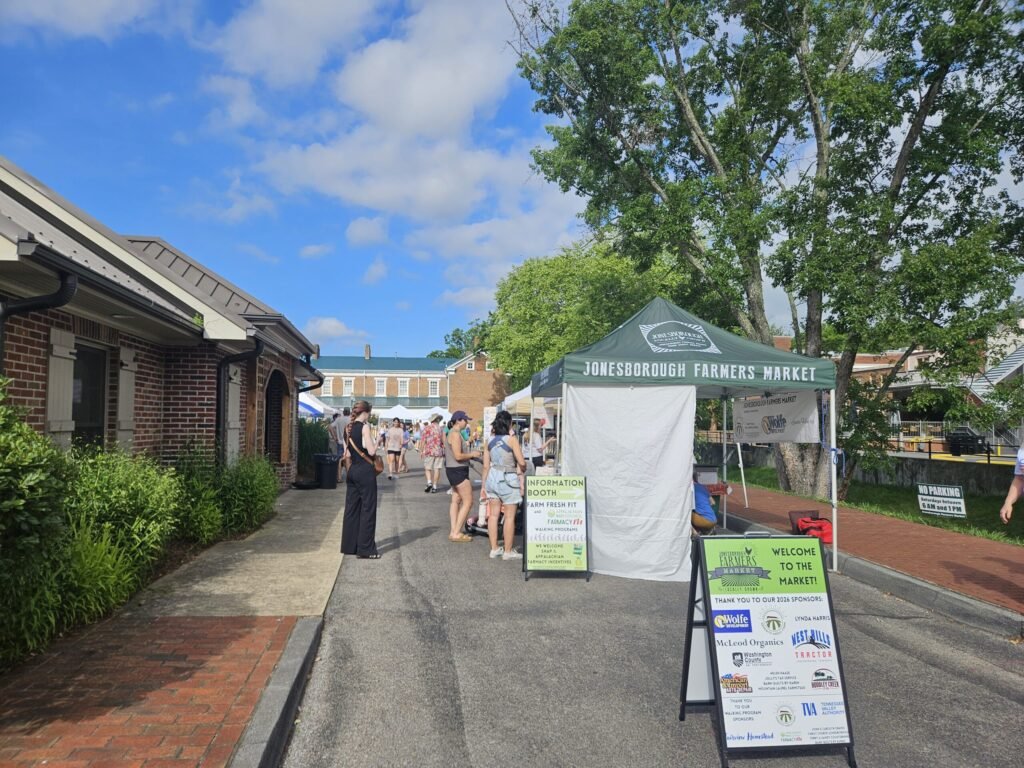 20260613_092714 - Appalachian Highlands Farmers Magazine Jonesborough farmers market scene with green Jonesborough Farmers Market - photo by A. Creighton