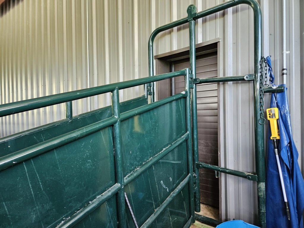 20260613_143543 - Appalachian Highlands Farmers Magazine A cattle chute that leads to the door to the inside of the facility.