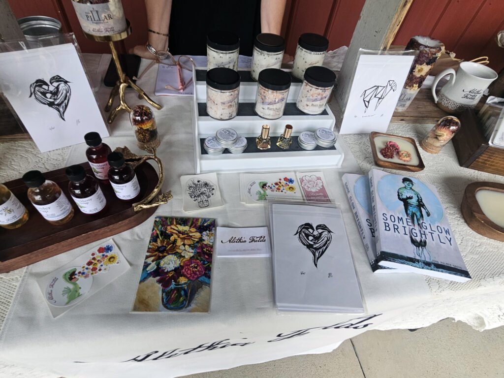 A variety of products and art along with Some Glow Brightly by John Palmer Gregg