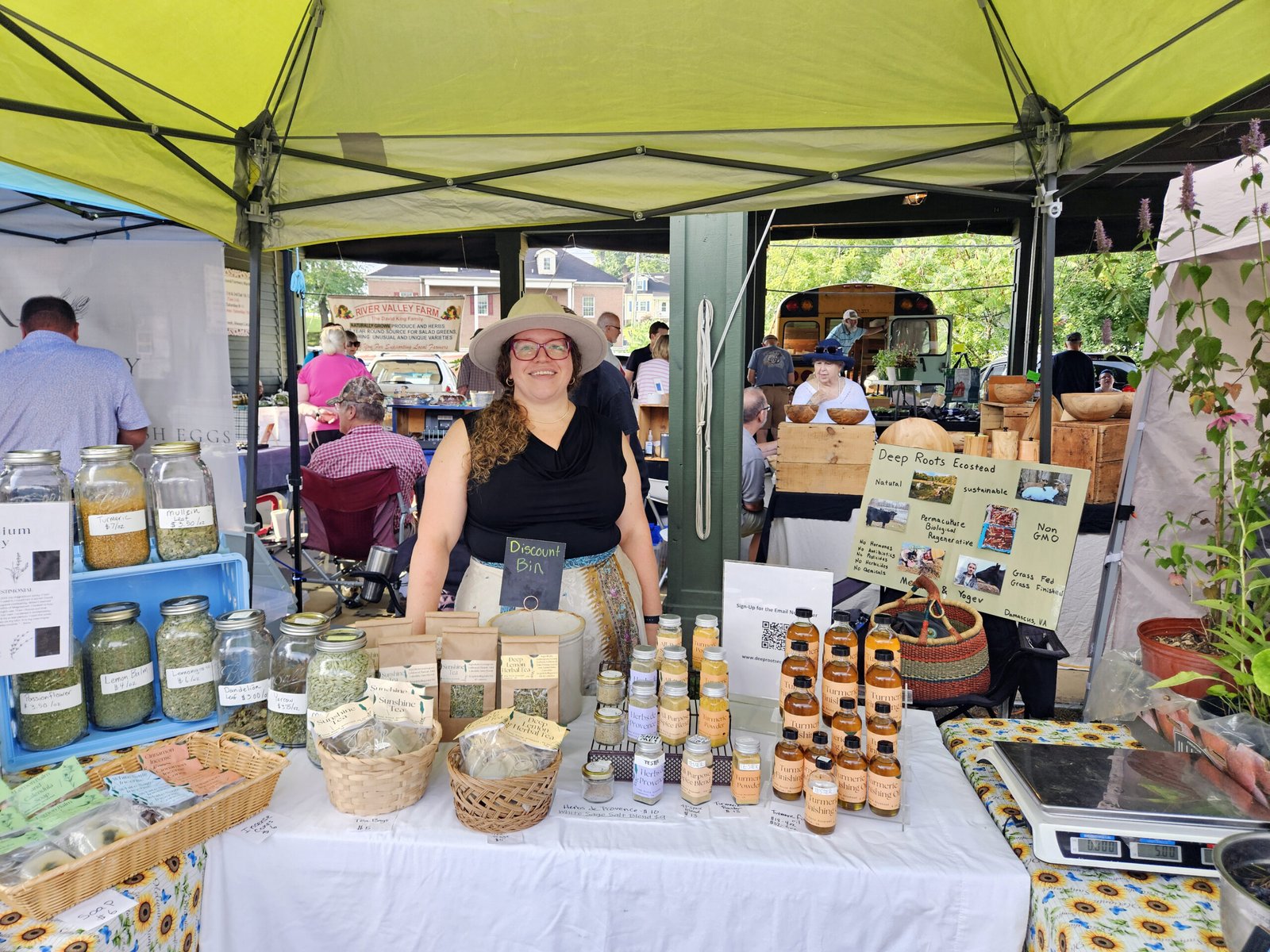 20260718_081907 - Appalachian Highlands Farmers Magazine Megan Boissiere standing at her booth for Deep Roots Ecostead