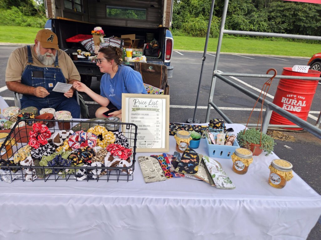 Scrunchies, honey, and other items for sale at the Crooked Row Farm Tent