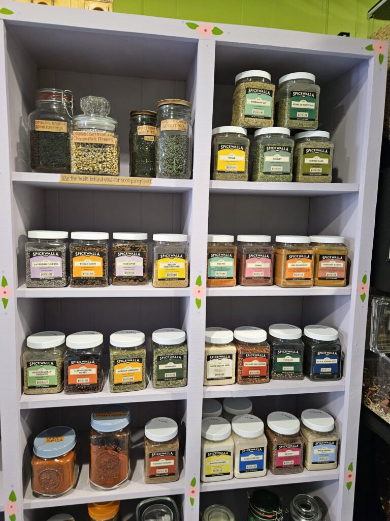 A pantry full pf a variety of teas spices, herbs