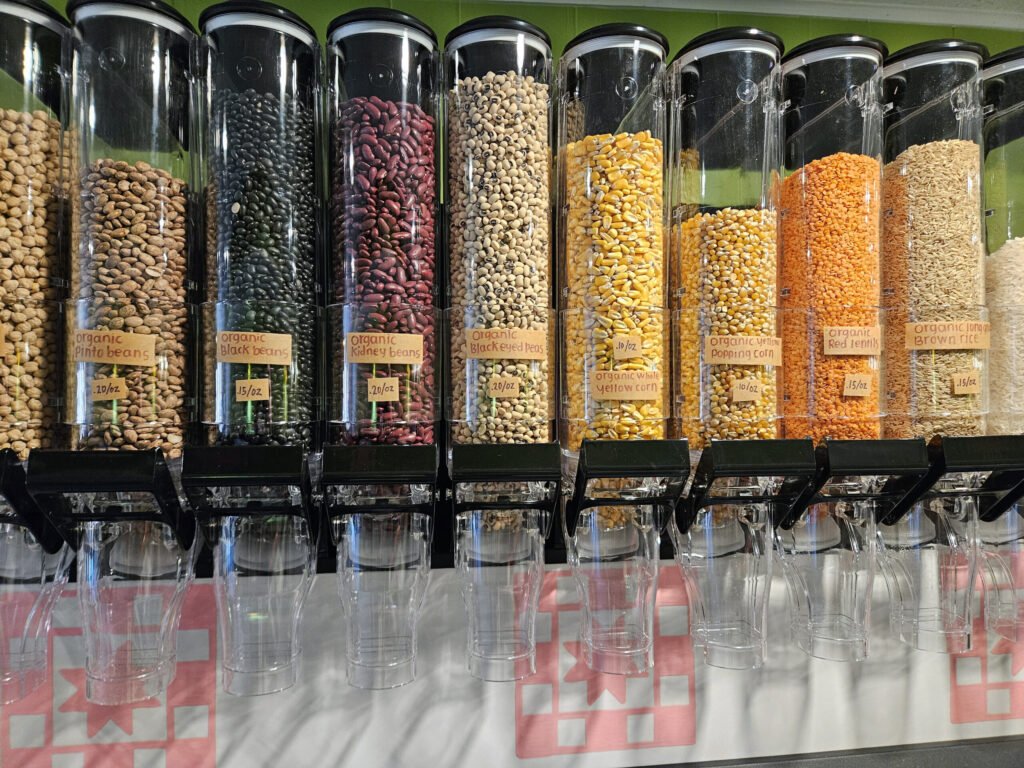 Bulk containers of various beans, corn, lentils, rice