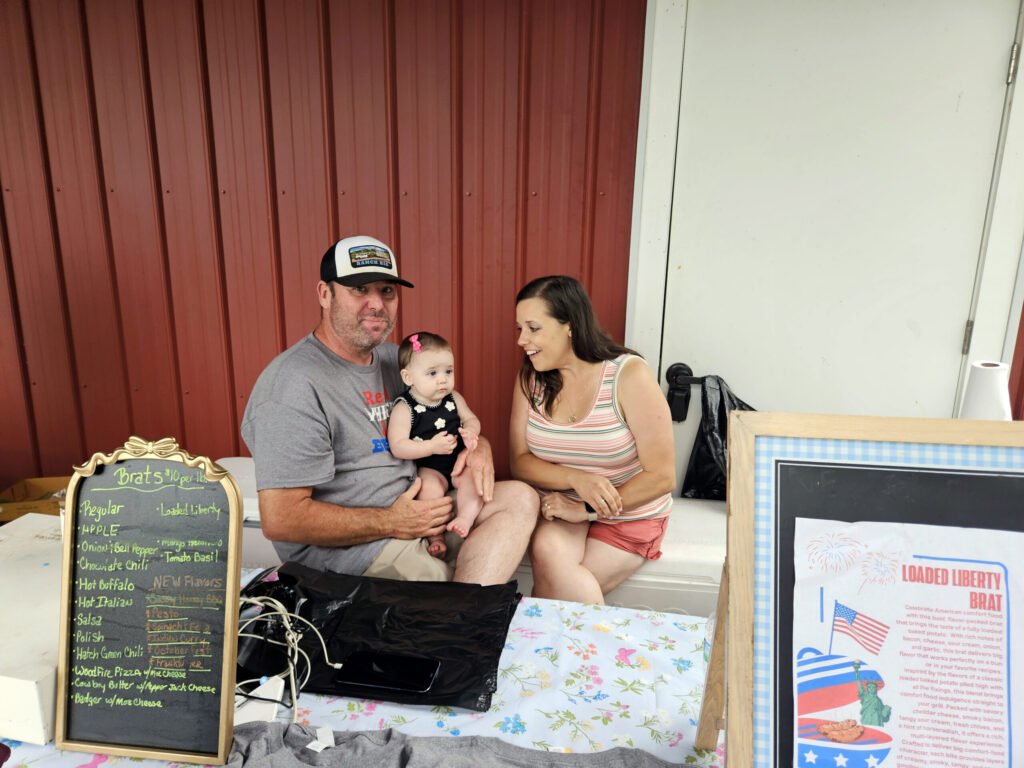 Keith Fleenor holds baby LeDoux while Sabrina talks to her.