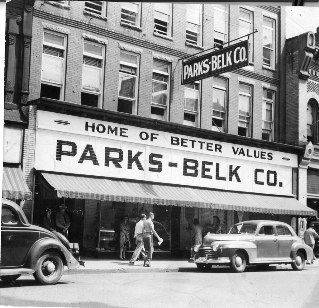 Historic Park-Belk Co. department store storefront with a bold 'HOME OF BETTER VALUES' sign and a striped awning, mid-20th century street scene.