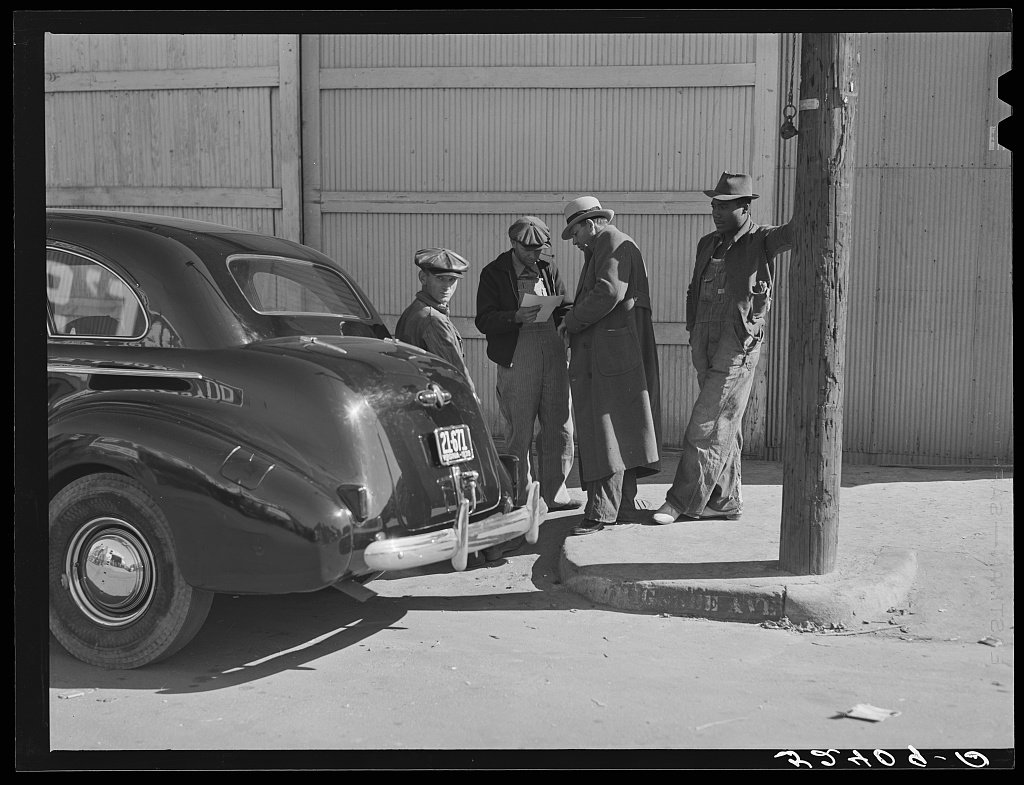 Farmers looking at their checks outside tobacco warehouse after auction sales. Durham, North Carolina 1939 Nov - Wolcott, Marion Post, 1910-1990