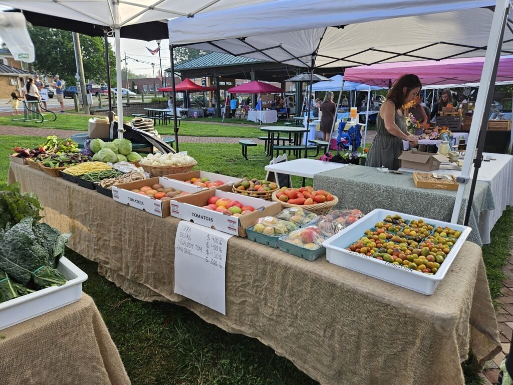 20260718_075449 - Appalachian Highlands Farmers Magazine Farmers Market table stocked with produce