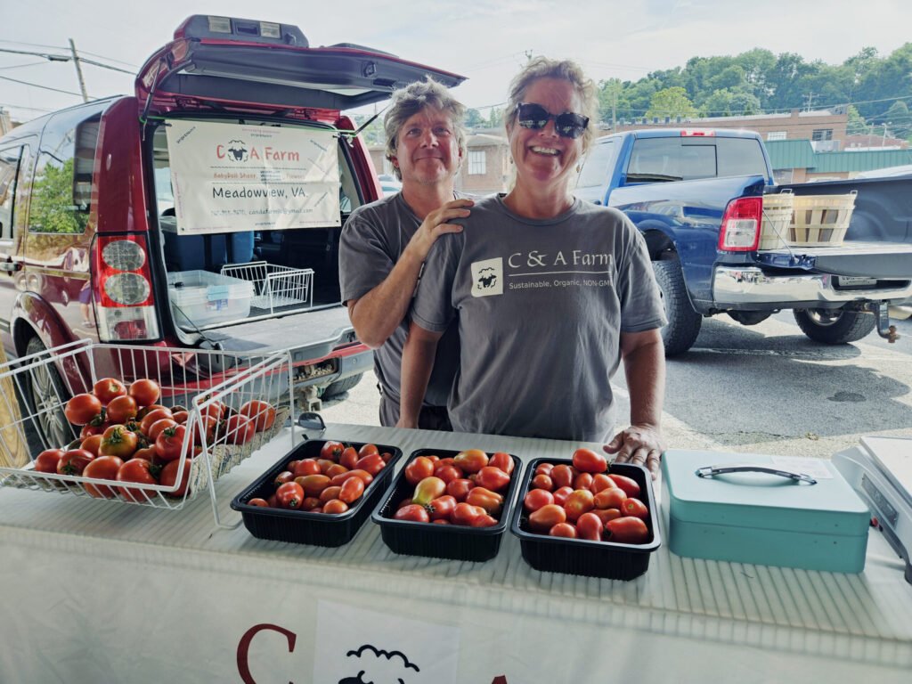 Christopher and Andrea Metcalf, Owners of C&A Farm at the Marion Farmers Market - Photo by A. Creighton