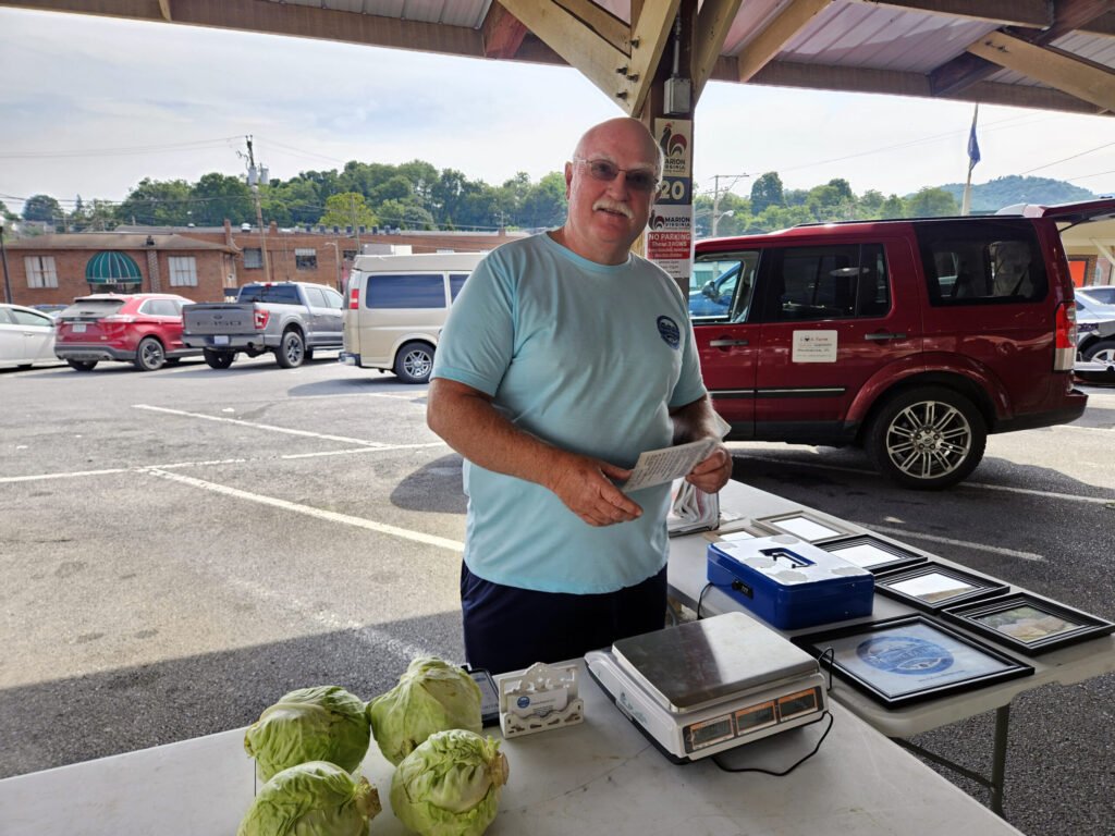 Chuck Doane, owner of Doane Farms at the Marion Farmers Market - Photo by A. Creighton