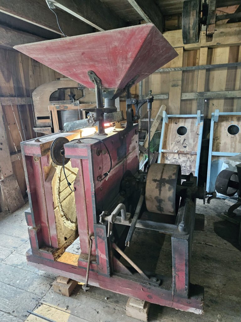 A more modern mill with stones exposed so visitors can see how they work.
