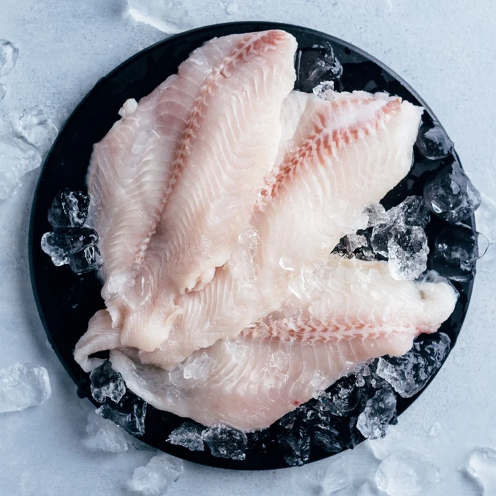 Catfish Filets on ice photo by Sizzlefish.