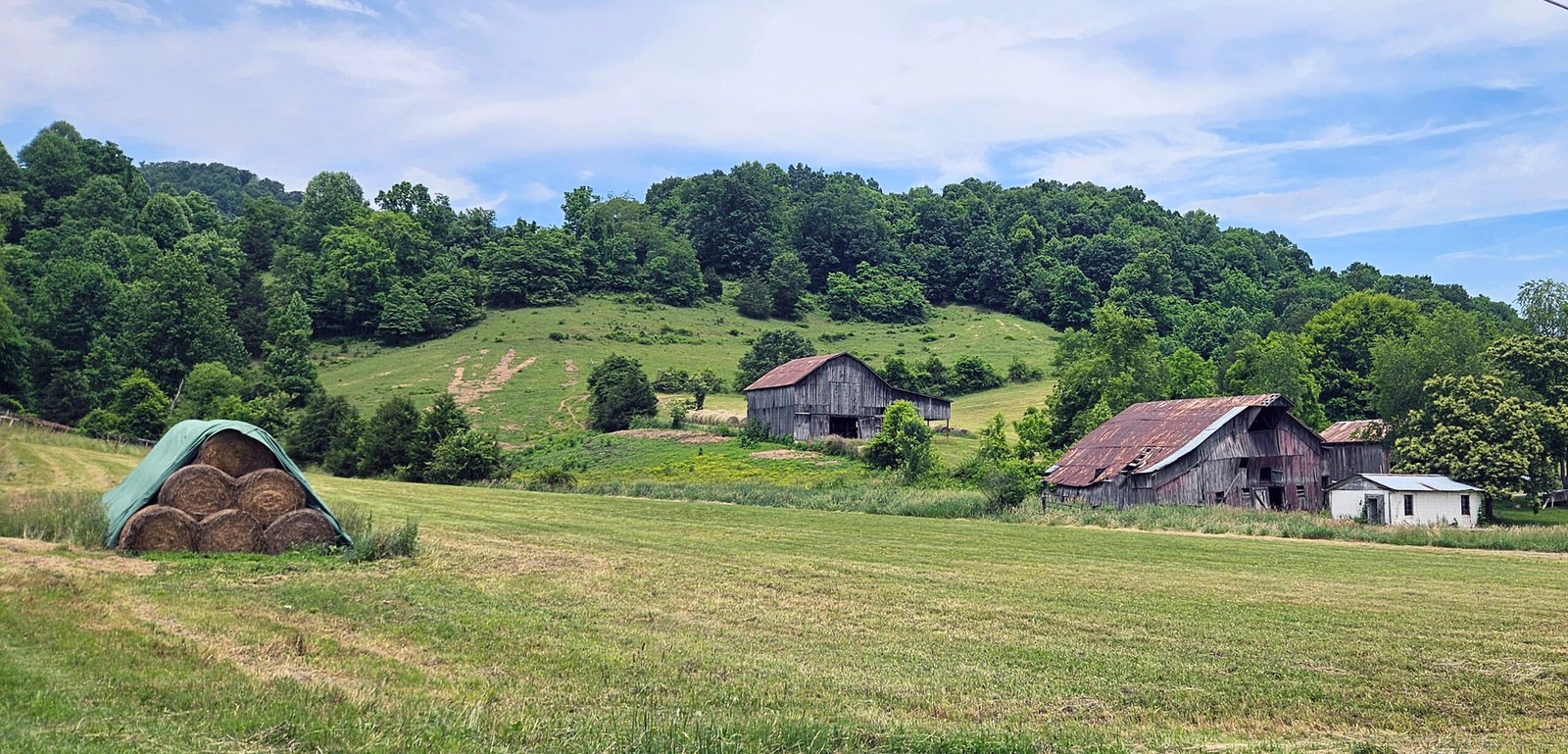 A farm with a barn in the distance. - TAEP Update Meeting