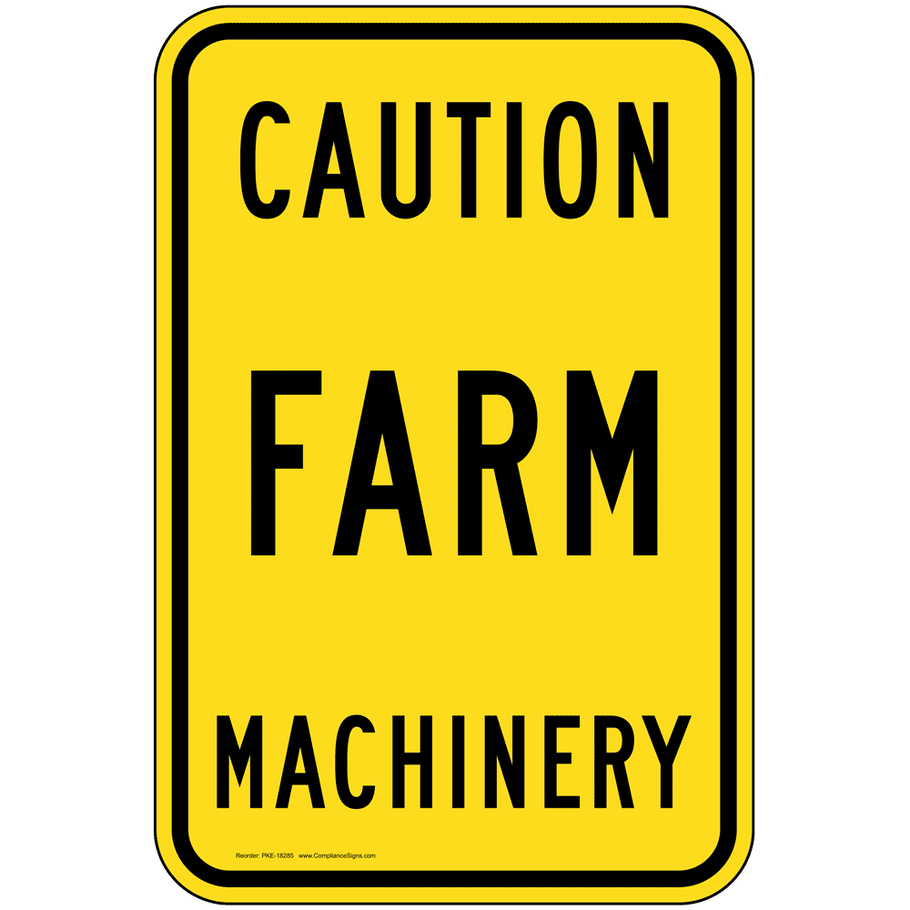 A sign that says, Caution Farm Machinery for Ag Safety Day